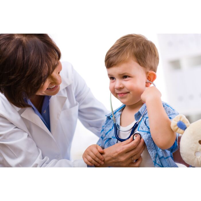 Senior Female Doctor Examining Happy Child Smiling - ID # 10651289