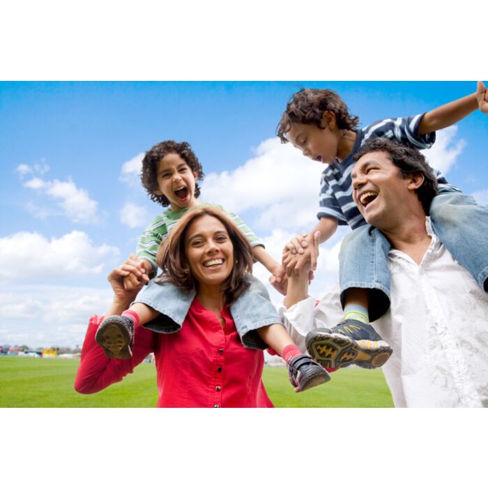 Happy Family Having Fun In Front Of Their House - ID # 14482771