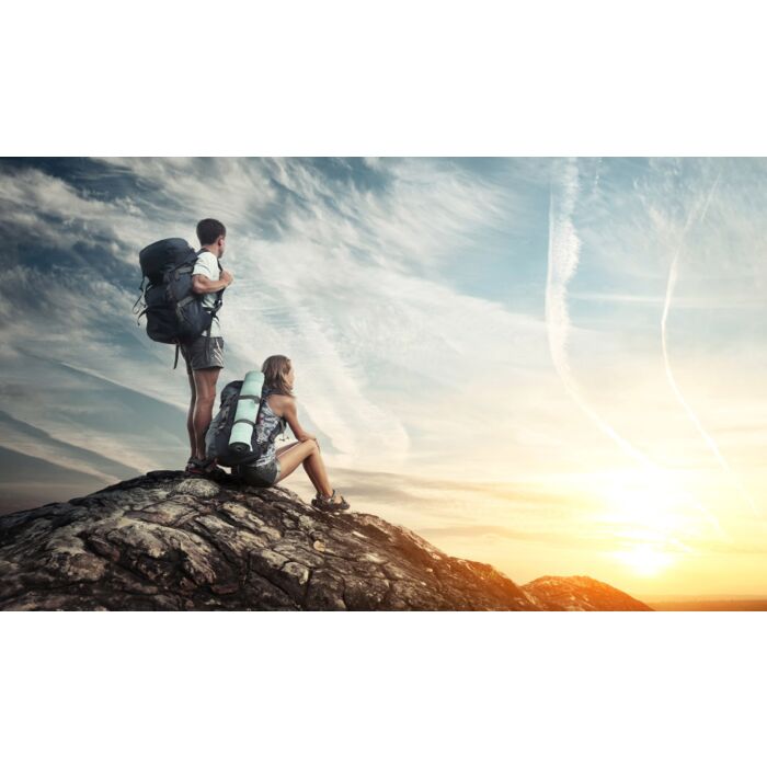 Two tourists with backpacks enjoying sunset  - ID # 115800856