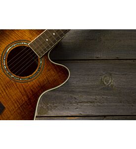 Acoustic guitar on wood background - ID # 134601494