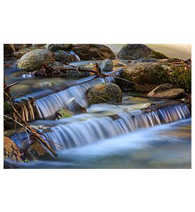 Nice small waterfall cascade on mountain river - ID # 246079714